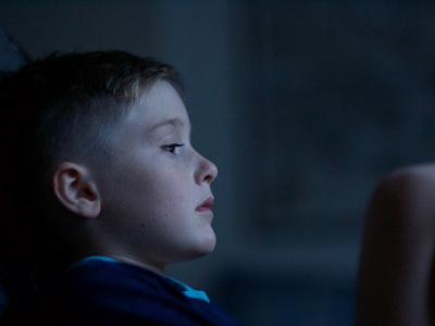 Sad boy in dark room - Photo by Luke Pennystan on Unsplash